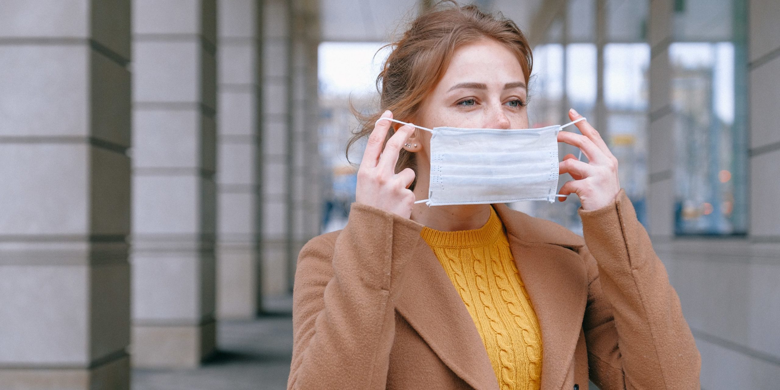 pexels-anna-shvets-3902732 woman putting on face mask