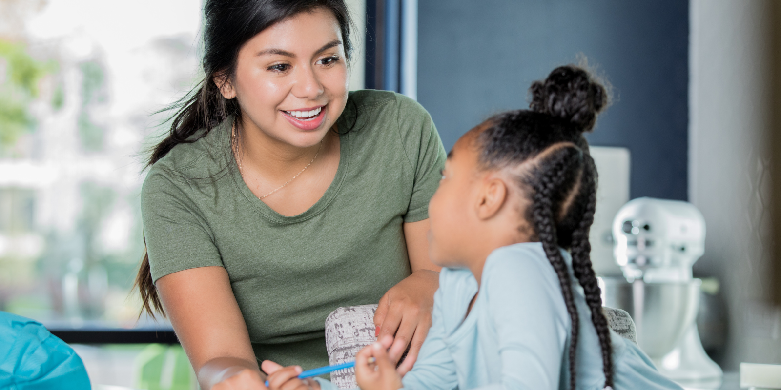 Untitled design-8 woman smiling at child