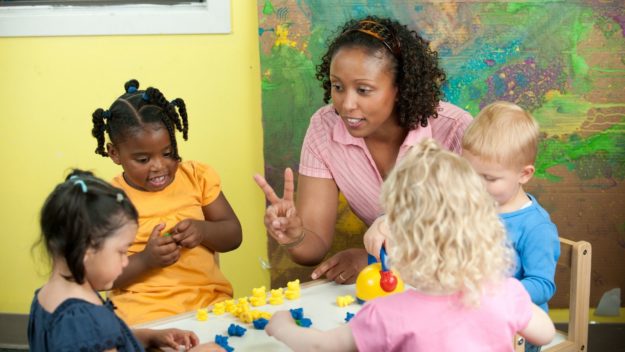 Untitled design Woman teaching children